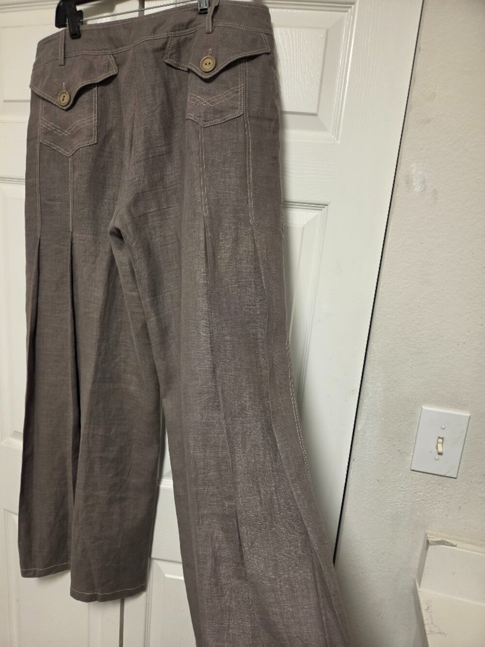 Linen pants with side pleats and back pockets.